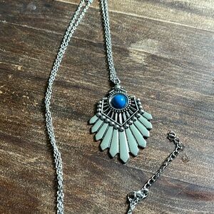 Silver tone long necklace with blue stone